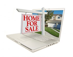 Home for Sale Sign & New Home on Laptop