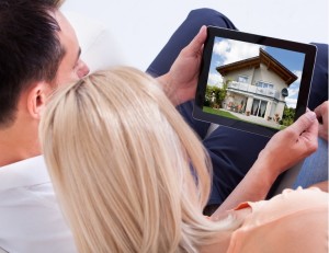 Couple Looking At Digital Tablet